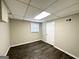 Finished basement area with laminate flooring, natural light and fresh paint at 5906 Pine Hurst Way, Douglasville, GA 30135