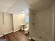 Bathroom features include a standing sink, shower, toilet, modern lighting, and wood-look flooring at 5906 Pine Hurst Way, Douglasville, GA 30135