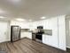 Modern kitchen featuring white cabinetry, stainless steel appliances, and granite countertops at 5906 Pine Hurst Way, Douglasville, GA 30135