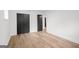 Empty bedroom with hardwood flooring, closet and natural lighting at 410 Queen Aliese Ln, Jonesboro, GA 30236