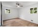Empty bedroom featuring hardwood flooring, ample natural lighting and ceiling fan at 410 Queen Aliese Ln, Jonesboro, GA 30236