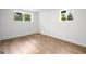 Empty bedroom featuring hardwood flooring and ample natural lighting at 410 Queen Aliese Ln, Jonesboro, GA 30236