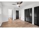 Bedroom featuring hardwood flooring, large closets, and ensuite bathroom at 410 Queen Aliese Ln, Jonesboro, GA 30236