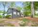 A beautifully renovated two-story home with a combination of gray brick and white siding at 410 Queen Aliese Ln, Jonesboro, GA 30236