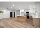 Bright, open-concept kitchen with hardwood floors and large center island at 410 Queen Aliese Ln, Jonesboro, GA 30236