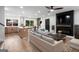 Spacious living room with modern furnishings, hardwood floors, fireplace, and an open layout at 410 Queen Aliese Ln, Jonesboro, GA 30236