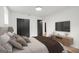 Comfortable main bedroom with neutral decor, king bed, and convenient media center at 410 Queen Aliese Ln, Jonesboro, GA 30236