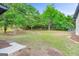Large backyard filled with mature trees creating a shaded outdoor space at 115 Linda Way, Fayetteville, GA 30215