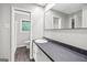 Bathroom with a white vanity, large mirror, and tiled floors at 115 Linda Way, Fayetteville, GA 30215