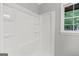 Bathroom with a shower stall and window at 115 Linda Way, Fayetteville, GA 30215