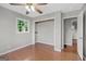 Bright bedroom featuring a hardwood floor, a closet, and a window at 115 Linda Way, Fayetteville, GA 30215