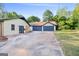 Long driveway that leads to a garage with a spacious parking area at 115 Linda Way, Fayetteville, GA 30215