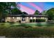 Charming ranch-style home with well-maintained lawn, showcasing a welcoming and classic façade at 115 Linda Way, Fayetteville, GA 30215