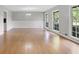 Light-filled living room with large windows and laminate wood flooring at 115 Linda Way, Fayetteville, GA 30215