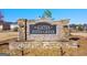 Stone entrance sign to The Gates at Pates Creek community with landscaping at 1816 Quaker St, Hampton, GA 30228
