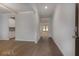 The entryway features hardwood flooring and views into other rooms of the house, and a secure keyless entry at 1816 Quaker St, Hampton, GA 30228