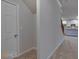 Hallway featuring a storage space, with views into the kitchen and upstairs area at 1816 Quaker St, Hampton, GA 30228