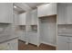 Kitchen with sleek white cabinetry, stainless steel appliances, and stylish granite countertops at 1816 Quaker St, Hampton, GA 30228