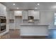 Modern kitchen showcasing stainless steel appliances, granite countertops, and a kitchen island at 1816 Quaker St, Hampton, GA 30228