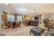 Basement featuring ample seating around a wooden game table with views to additional seating at 95 Weslyan Way, Oxford, GA 30054