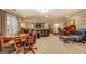 Open basement layout, featuring a seating area, desk and game table with plenty of light at 95 Weslyan Way, Oxford, GA 30054