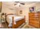 Inviting bedroom features a wooden bed frame, soft lighting, and hardwood floors at 95 Weslyan Way, Oxford, GA 30054