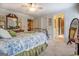 Comfortable bedroom featuring a wrought iron bed, a mirror, and stylish decor elements at 95 Weslyan Way, Oxford, GA 30054