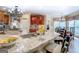 Bright, open kitchen featuring granite countertops and a large island with seating at 95 Weslyan Way, Oxford, GA 30054