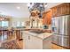 Kitchen with an island, stainless steel appliances, and access to a dining area at 95 Weslyan Way, Oxford, GA 30054