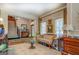 Living room with hardwood floors, multiple windows, and staircase leading to the second floor at 95 Weslyan Way, Oxford, GA 30054