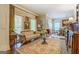 Comfortable living room showcases hardwood floors and three large windows with natural light at 95 Weslyan Way, Oxford, GA 30054
