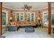 Stylish outdoor living space featuring brick walls, cozy seating, and ample lighting at 95 Weslyan Way, Oxford, GA 30054