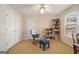 Bedroom featuring a comfortable chair, desk, ceiling fan, and bookshelf at 5 Renfroe Ct, Decatur, GA 30030