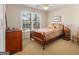 Quaint bedroom with a full-sized bed, ceiling fan, and two windows at 5 Renfroe Ct, Decatur, GA 30030