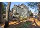 Home exterior with multi-level decks, lovely yard and mature trees creating a tranquil setting at 5 Renfroe Ct, Decatur, GA 30030