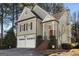 Charming home featuring a brick staircase, red front door, and two-car garage at 5 Renfroe Ct, Decatur, GA 30030