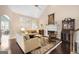 Inviting living room featuring a fireplace, hardwood floors, and large windows with plantation shutters at 5 Renfroe Ct, Decatur, GA 30030