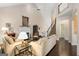 Bright living room with fireplace, hardwood floors, and staircase to upper level at 5 Renfroe Ct, Decatur, GA 30030