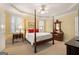 Comfortable bedroom with tray ceiling, carpet floors, and classic furniture at 5 Renfroe Ct, Decatur, GA 30030