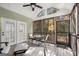 Well lit screened porch with door to deck, seating and tranquil views of yard at 5 Renfroe Ct, Decatur, GA 30030