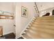 A carpeted staircase with wooden handrail leads to the upper level at 5 Renfroe Ct, Decatur, GA 30030
