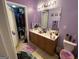 Dual-sink bathroom with toilet and closet at 1255 Chinon Pt, Lithonia, GA 30058