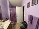 Compact bathroom with toilet, vanity, and small bathtub/shower combo at 1255 Chinon Pt, Lithonia, GA 30058