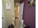 Bedroom entrance features an open door, calendar, and an abstract canvas painting at 1255 Chinon Pt, Lithonia, GA 30058