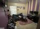 Bedroom with vertical striped accent wall, a daybed, and a desk at 1255 Chinon Pt, Lithonia, GA 30058