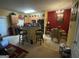Eat-in kitchen features a breakfast bar, modern chandelier, and a dining set at 1255 Chinon Pt, Lithonia, GA 30058