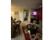 Open living space features a partial view of the kitchen and a TV at 1255 Chinon Pt, Lithonia, GA 30058