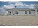 Backyard of home with covered patio and grill at 131 Meadowbrook Ln, Grantville, GA 30220