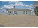 Exterior of home showing backyard and back patio at 131 Meadowbrook Ln, Grantville, GA 30220