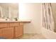 Bathroom with vanity, mirror, and shower-tub combo featuring modern fixtures at 131 Meadowbrook Ln, Grantville, GA 30220